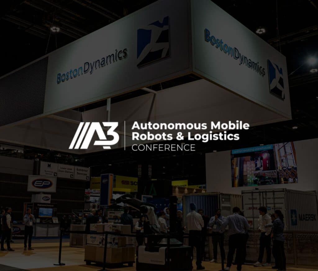 A Boston Dynamics trade show booth with Stretch in the foreground and the AMRL logo overlaid