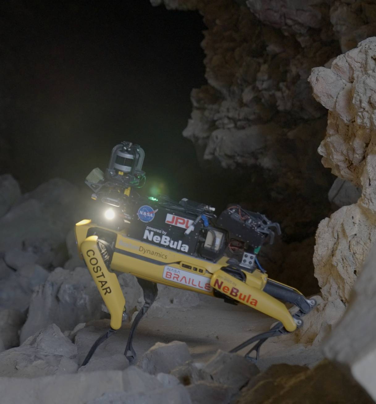 A Spot robot gathers data for NASA equipped with a custom payload in a cave