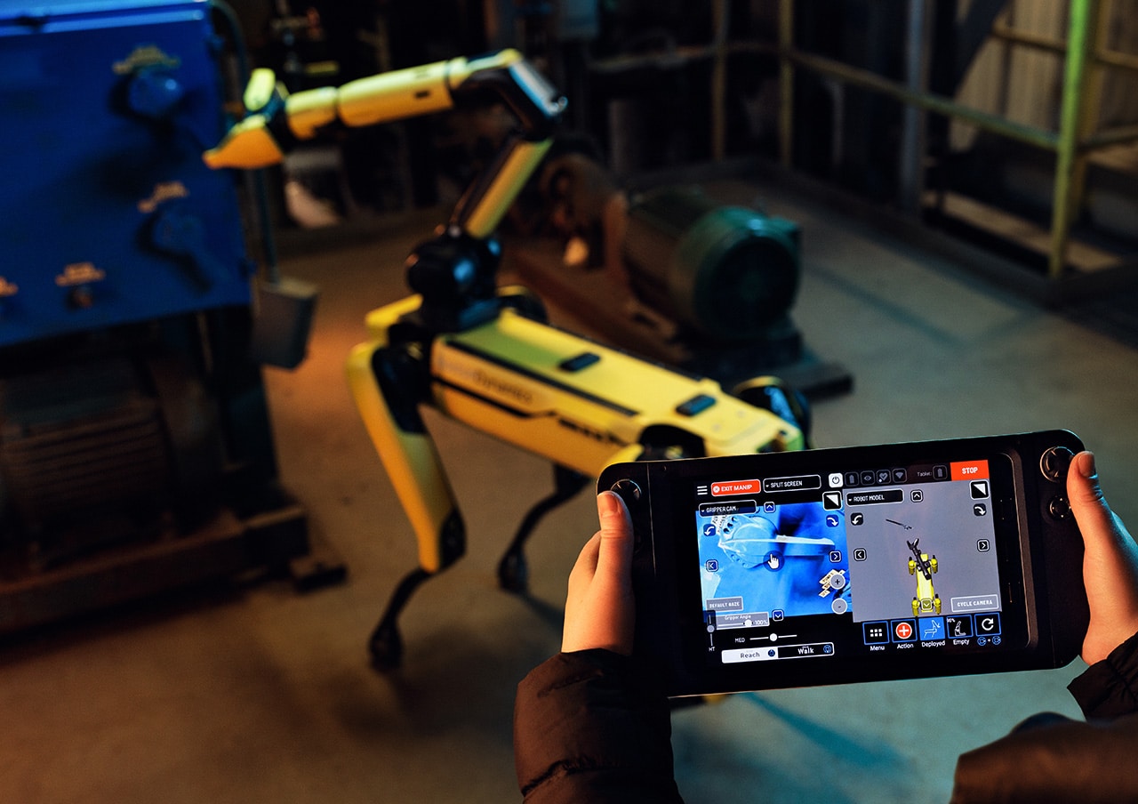 An over-the-shoulder view of the Spot tablet shows Spot's semi-autonomous manipulation capabilities
