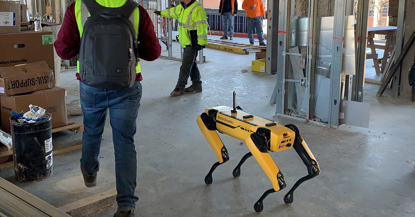 Spot operates around people on a busy construction site