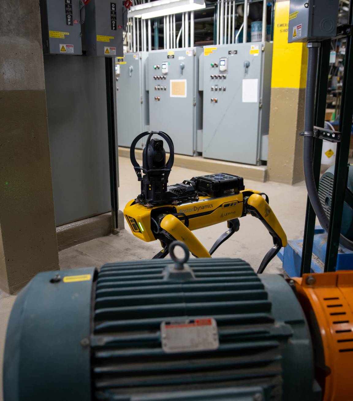 Spot performing a thermal inspection on a motor